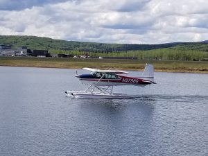 float plane taxis on the ski pond
